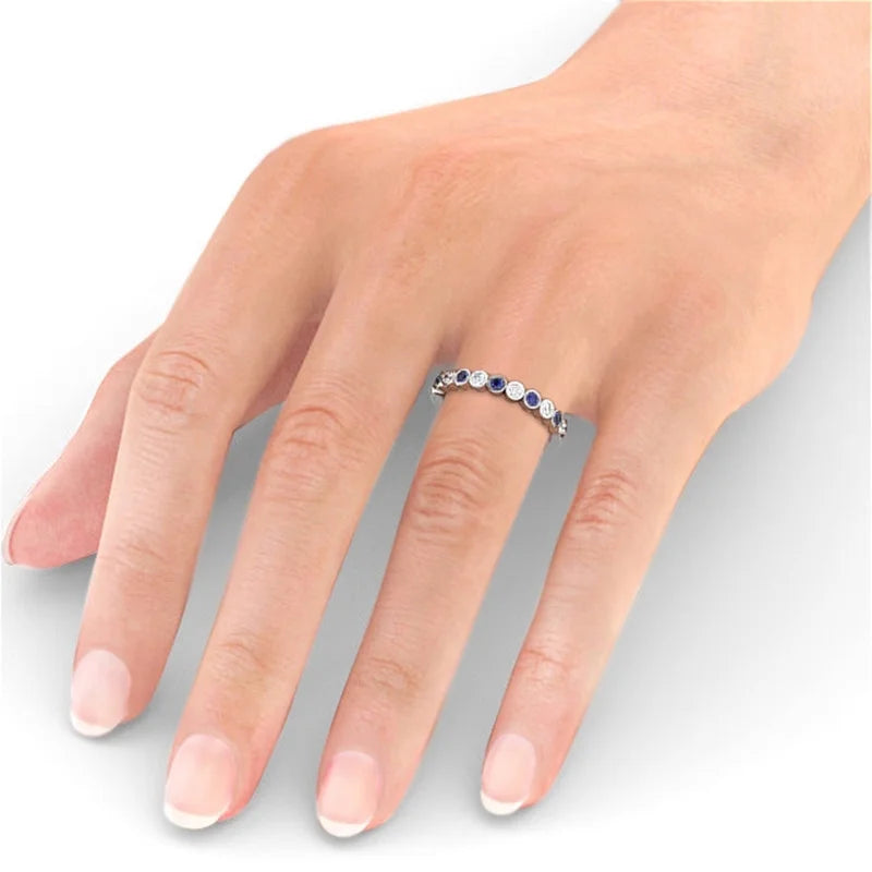 14K White Gold Eternity Band with Round Cut Diamond and Blue Sapphire A222484